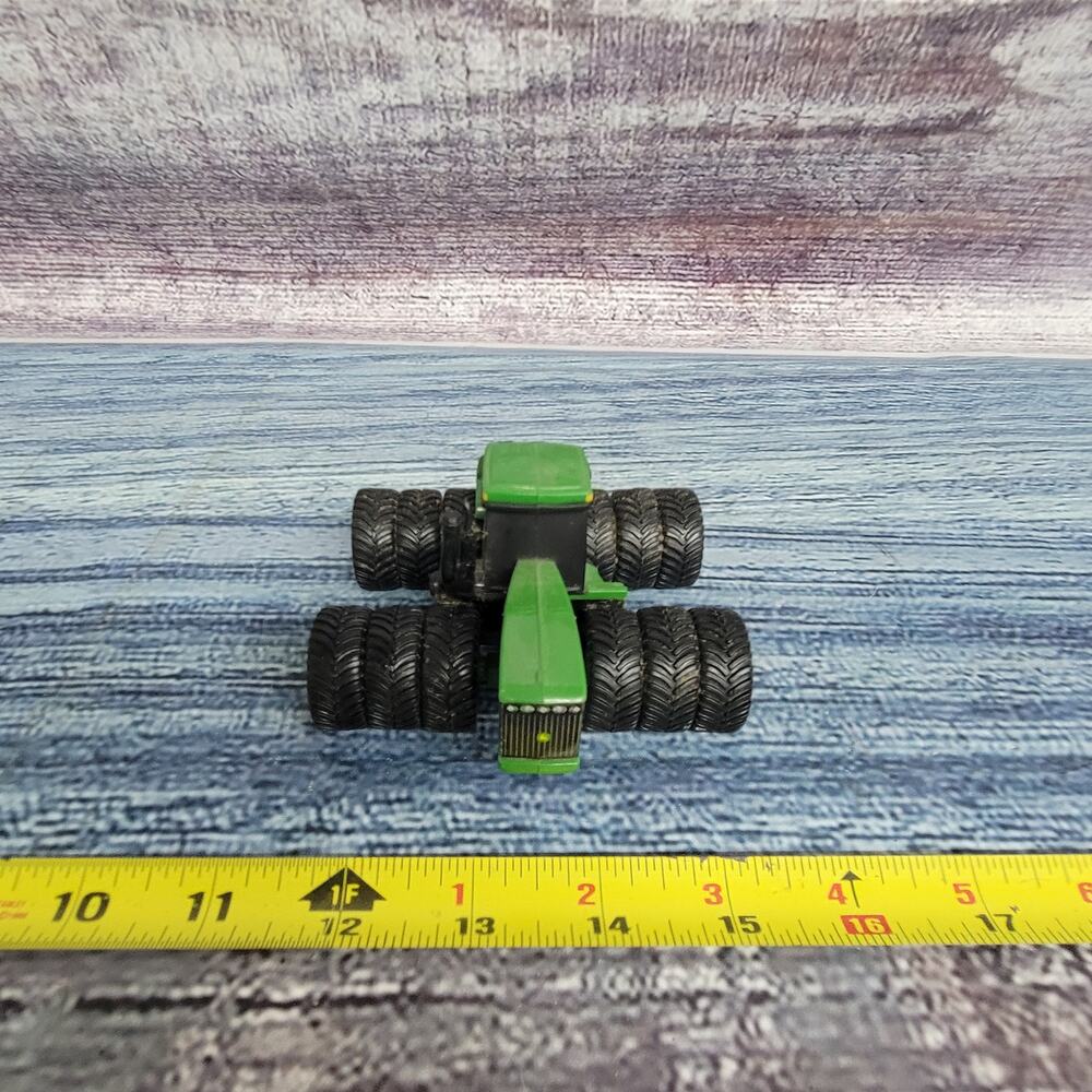 Ertl 1/64 scale Die-cast/plastic John Deere articulating tractor w/triples green